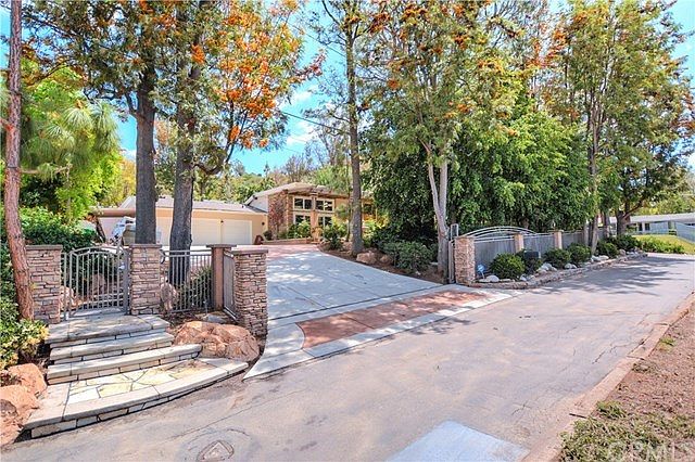 Incredibly Private Fully Gated Estate located on 21,750 Sq. Ft. Lot. Serene Location with Mature Lan