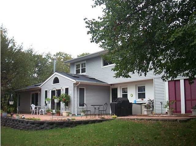 Back of the Home with addition, inground pool and large Paver Patio
