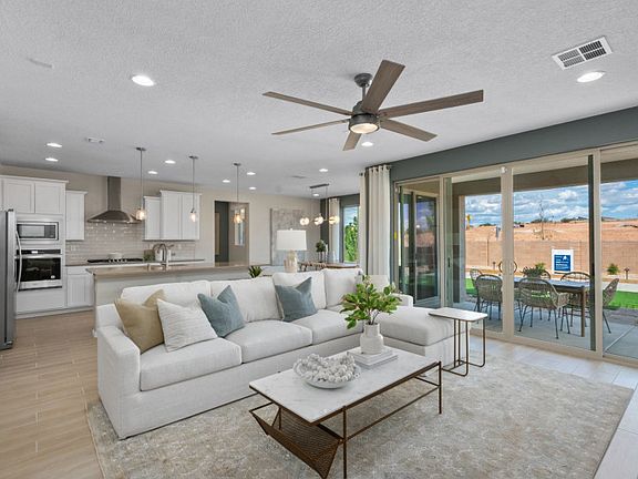 A large sliding glass door takes your indoor gatherings to the backyard and covered patio.