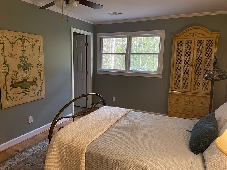Bedroom with beautiful view of trees. This has an en-suite bathroom.