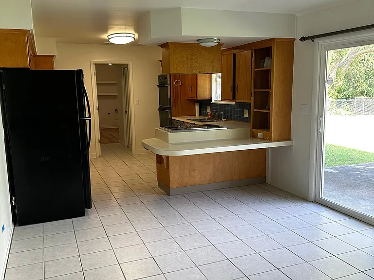Dining area view, looking into the kitchen.