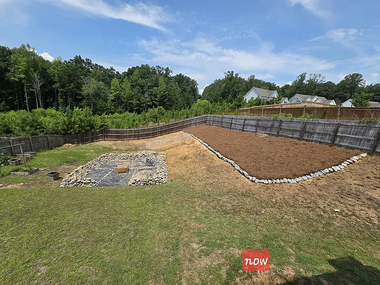 Back yard with space for fire pit and garden