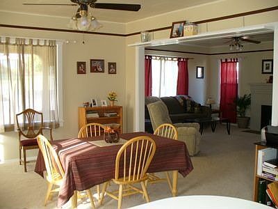 From kitchen looking through dining room to living room