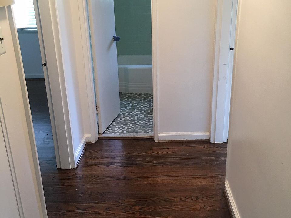 Hallway to bedrooms and bath. Linen closet on the left.