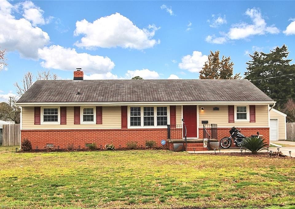 Turn key four bedroom, two and a half bath home in Hampton Virginia with detached garage and HUGE yard.