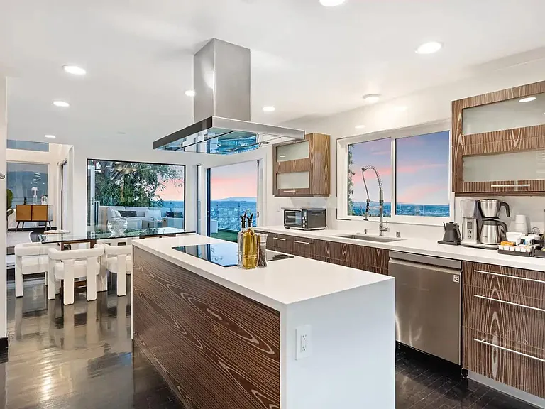 Create culinary masterpieces in our sleek kitchen with panoramic views.