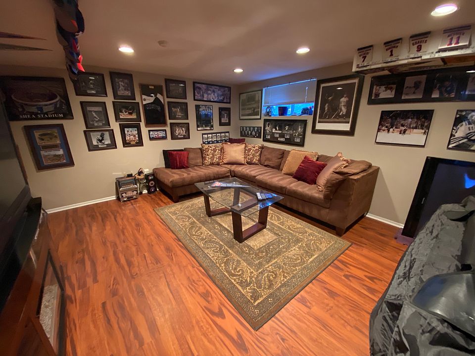 3rd bedroom/den. This room is not considered a bedroom only due to the size of the window. Closet and utility room on the left. Room is currently empty.