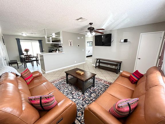 Living Room with leather sofas & Smart TV