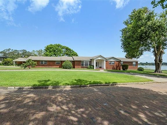 One story brick ranch with circular drive