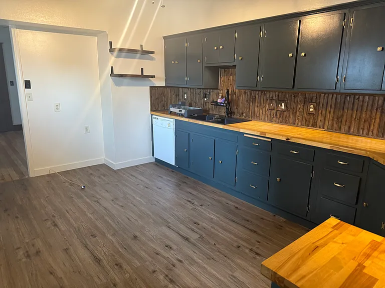 Not shown is a brand new refrigerator to the left of the shelves.