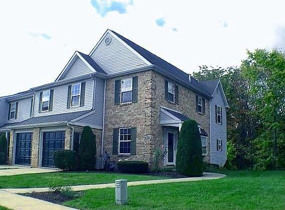 Side entrance and front view of 1-Car Garage