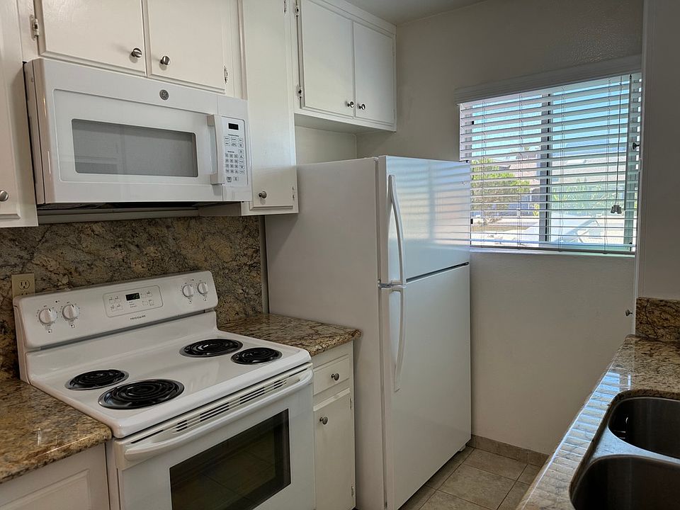 KITCHEN - New microwave, full size appliances, tile flooring granite counter tops and dual sink w/garbage disposal