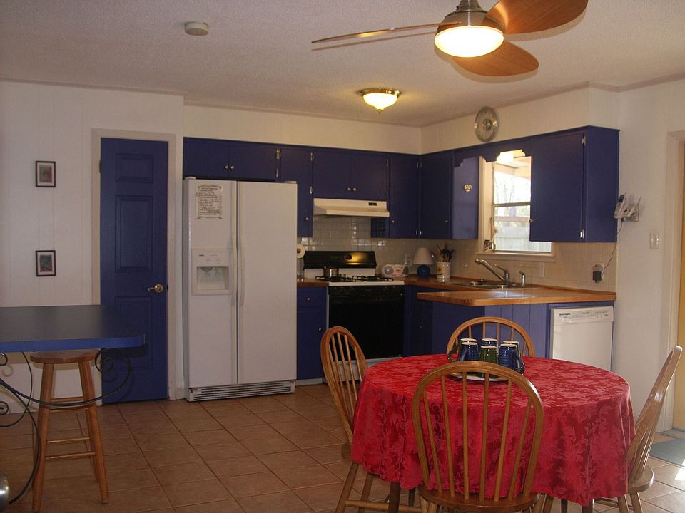 kitchen with large breakfast area & french doors to covered patio. 