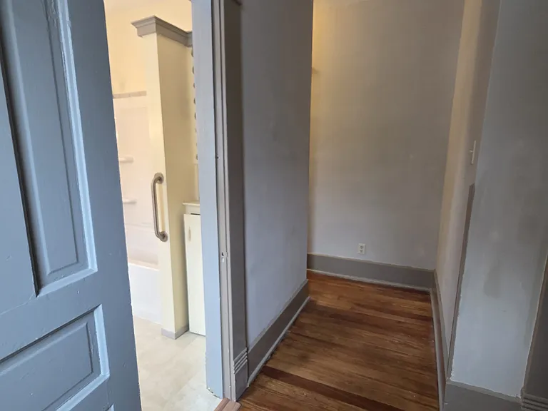 Looking down the hallway leading to bedroom 3 and 4.