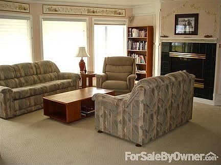 Den/family room in the walkout basement : Has a cozy gas fireplace and large windows.