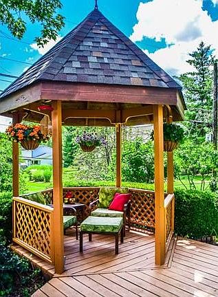 Charming gazebo complete with ceiling fan