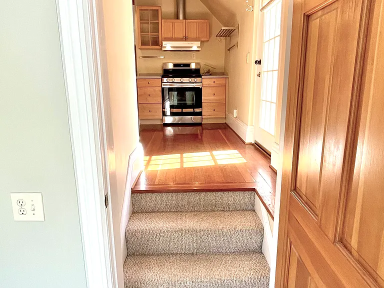 Entry to back bedroom or office into kitchen.
