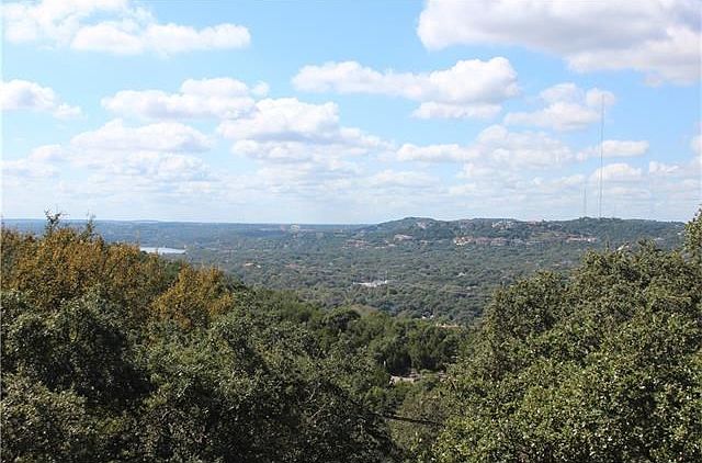 Start and finish your day with this serene view of the hill country and just a touch of the lake....ahhhh.