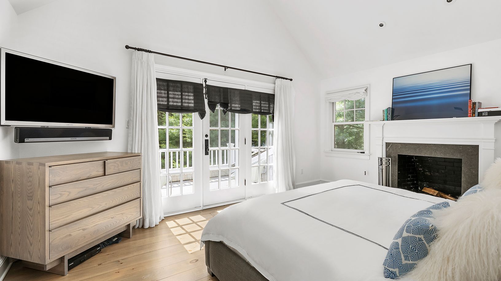  Primary bedroom and wood burning fireplace