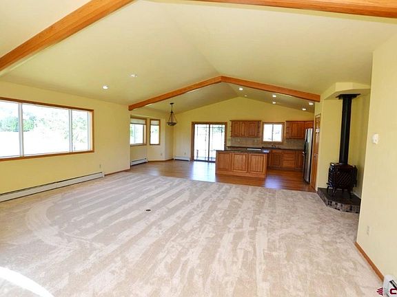 Open living design feels roomy and comfortable. Good natural light and views. New carpet throughout.