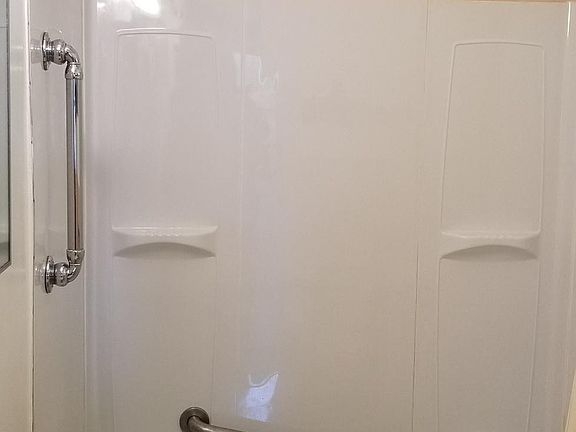 Bathroom with tub and shower