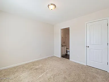 Front guest bedroom with access to guest bathroom.