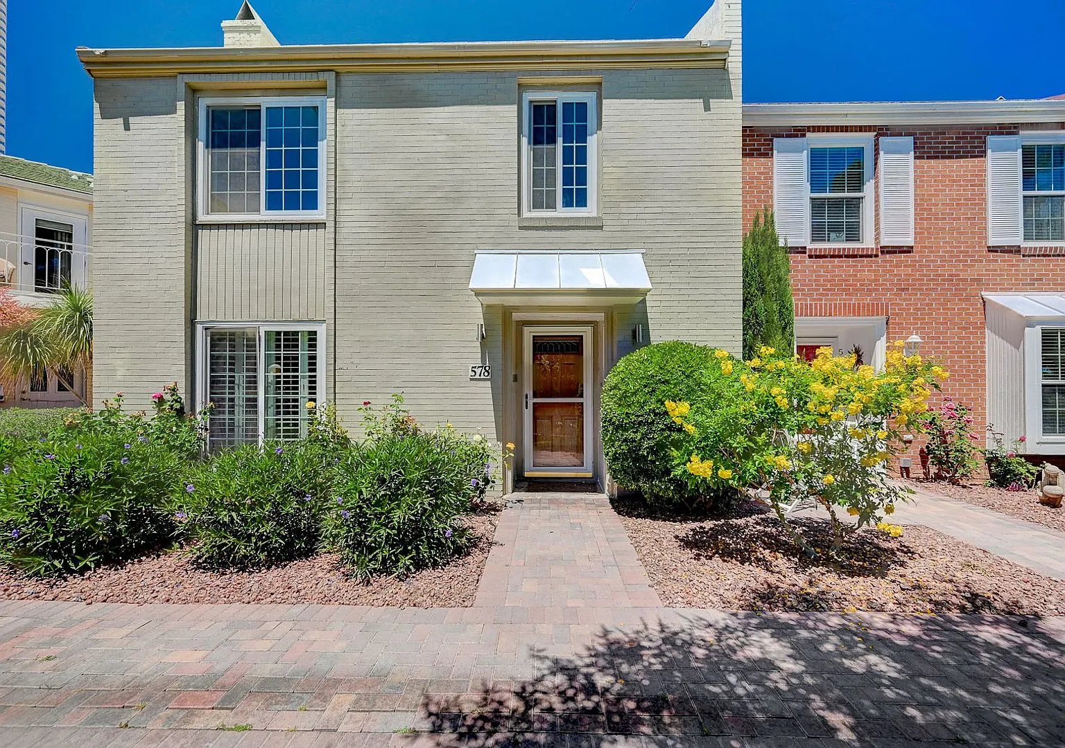 Beautiful 2 Bedroom Townhome in Guard-Gated Community Prime Location! — Photo 1
