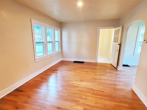 Living room looking into office & dining room