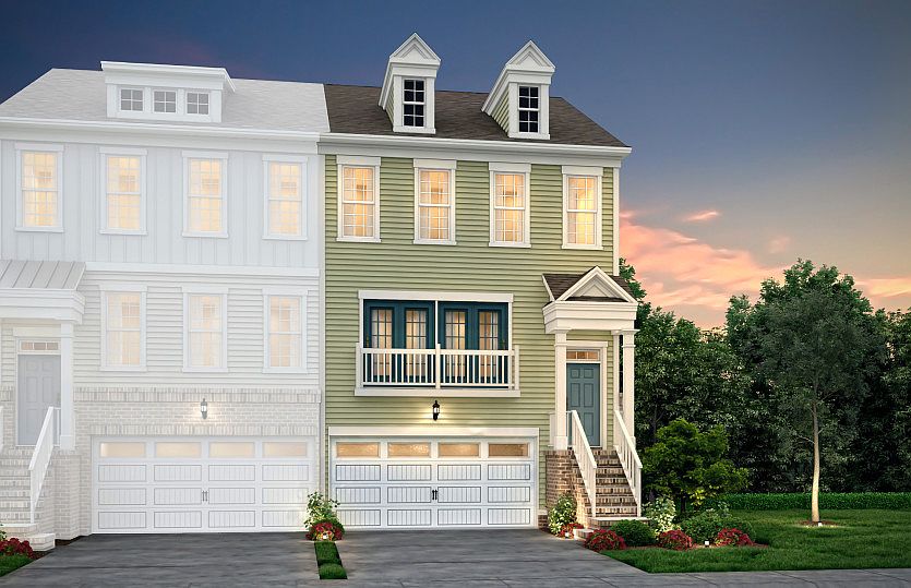 Devereaux Home Exterior B2 - 3 Story townhome w/ 2 car garage, brick accents and siding