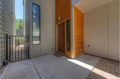 Front entry/carport. Access gate leads to your own private yard