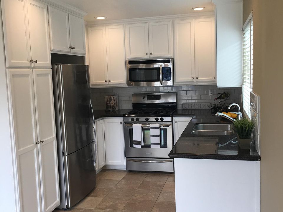 Gourmet kitchen with recessed lighting with nice Italian floor tile