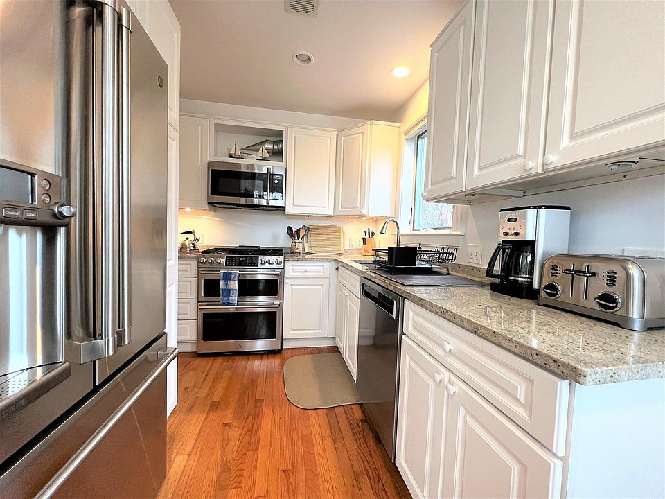 Updated kitchen, stainless appliances, pleasing granite counter tops, and a window above the sink.