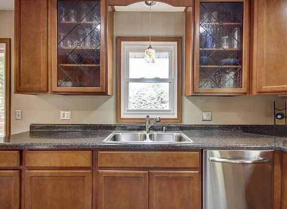 New kitchen features: new custom cabinets, countertops, lighting, flooring & stainless steel applian