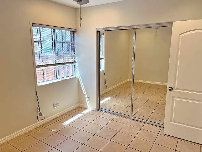Bedroom four has ceiling fan & standard closet.