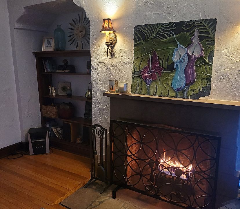 Wood burning fireplace and built in bookshelves in the living room.