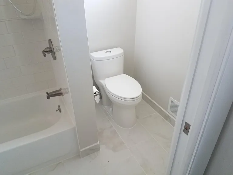 Pocket door separates master bedroom from bath