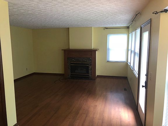 Den with Gas burning fireplace