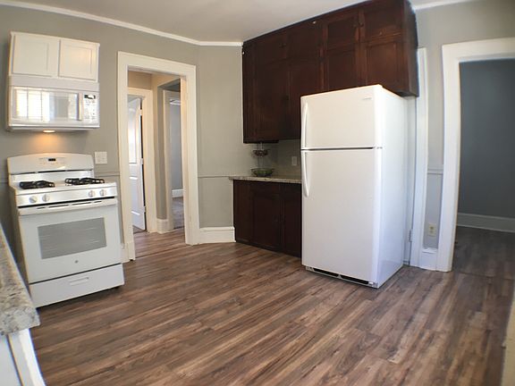 Kitchen with original built-ins and an extra storage room.