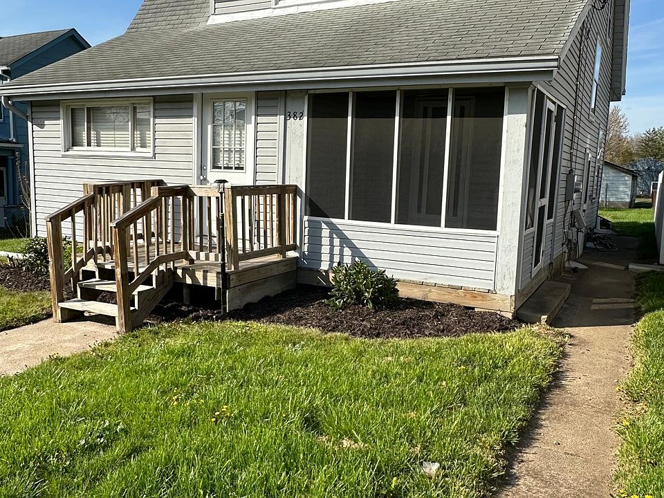 Front yard, screened in porch with a separate entrance.