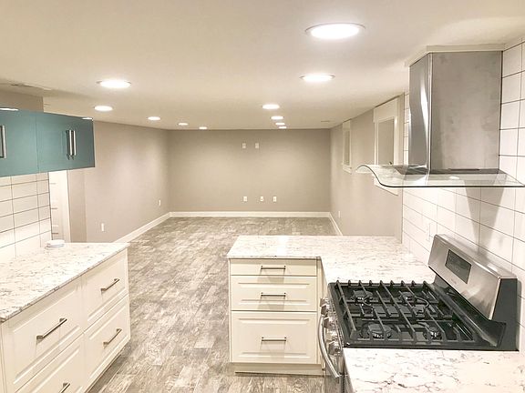 Brand-new kitchen with stainless steel appliances and loads