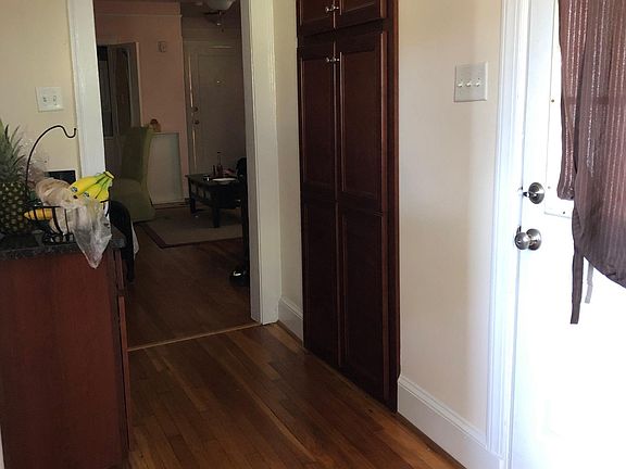 Kitchen--showing back door and entrance to Living/Dining Room. Note the pantry doors near the back door. It's a spacious pantry!