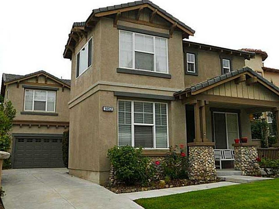 Long drive way and 3-car garage