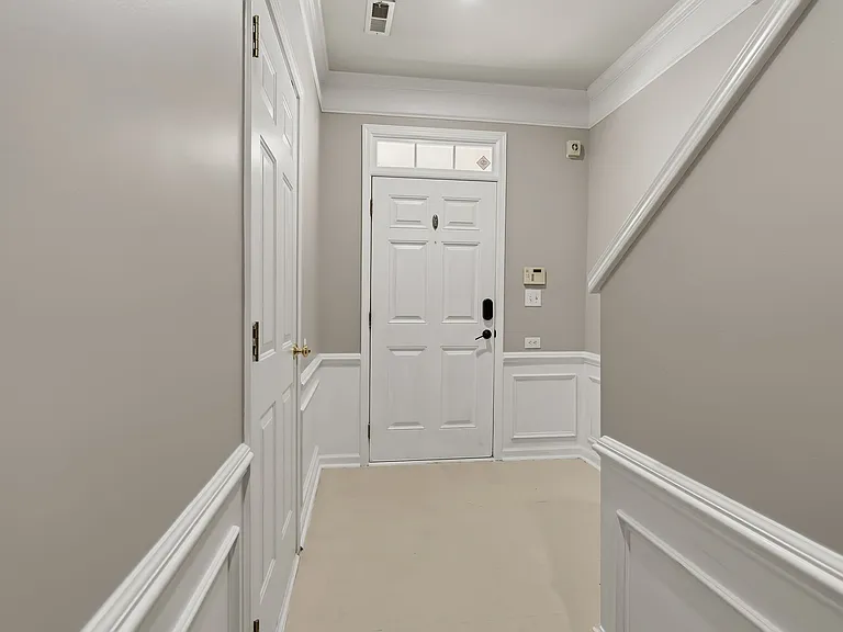 Main door and garage door to the left