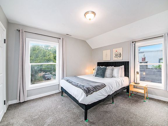 Queen size bed with nightstands and reading lights. BLACKOUT Curtains