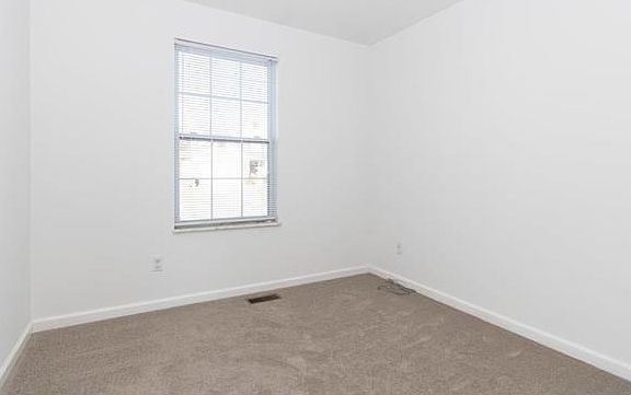Secondary bedroom #2. Newer carpeting. Window coverings. Newer paint.