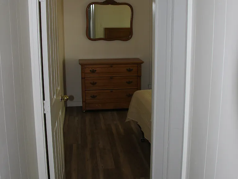 From hallway, looking into bedroom one. Bathroom is on the righthand side.