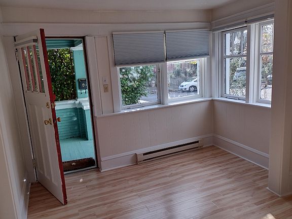 Livingroom looking out from kitchen- lots of windows and light