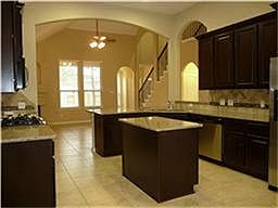 Loads of cabinetry, high end stainless appliances; all included:  washer / dryer / fridge / oven / microwave
