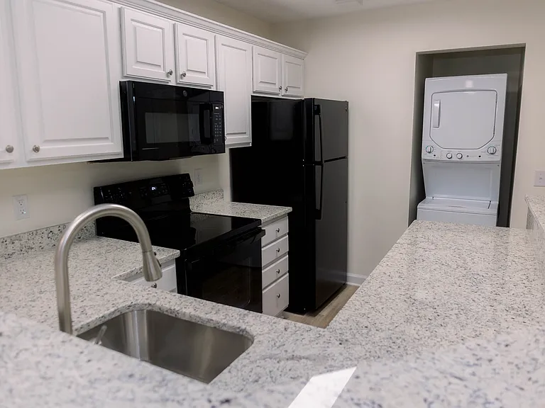 Granite countertops and farmhouse sinks! Generous cabinet space!