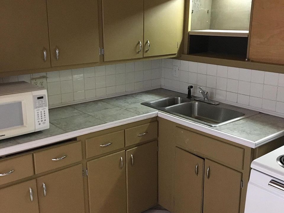 Good cabinet space, tile counter tops, and "
above the sink and stove" recessed back lighting